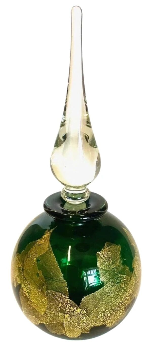 A green glass bottle with a clear top.