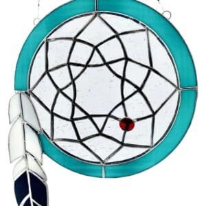 A stained glass window with a feather and a blue circle.