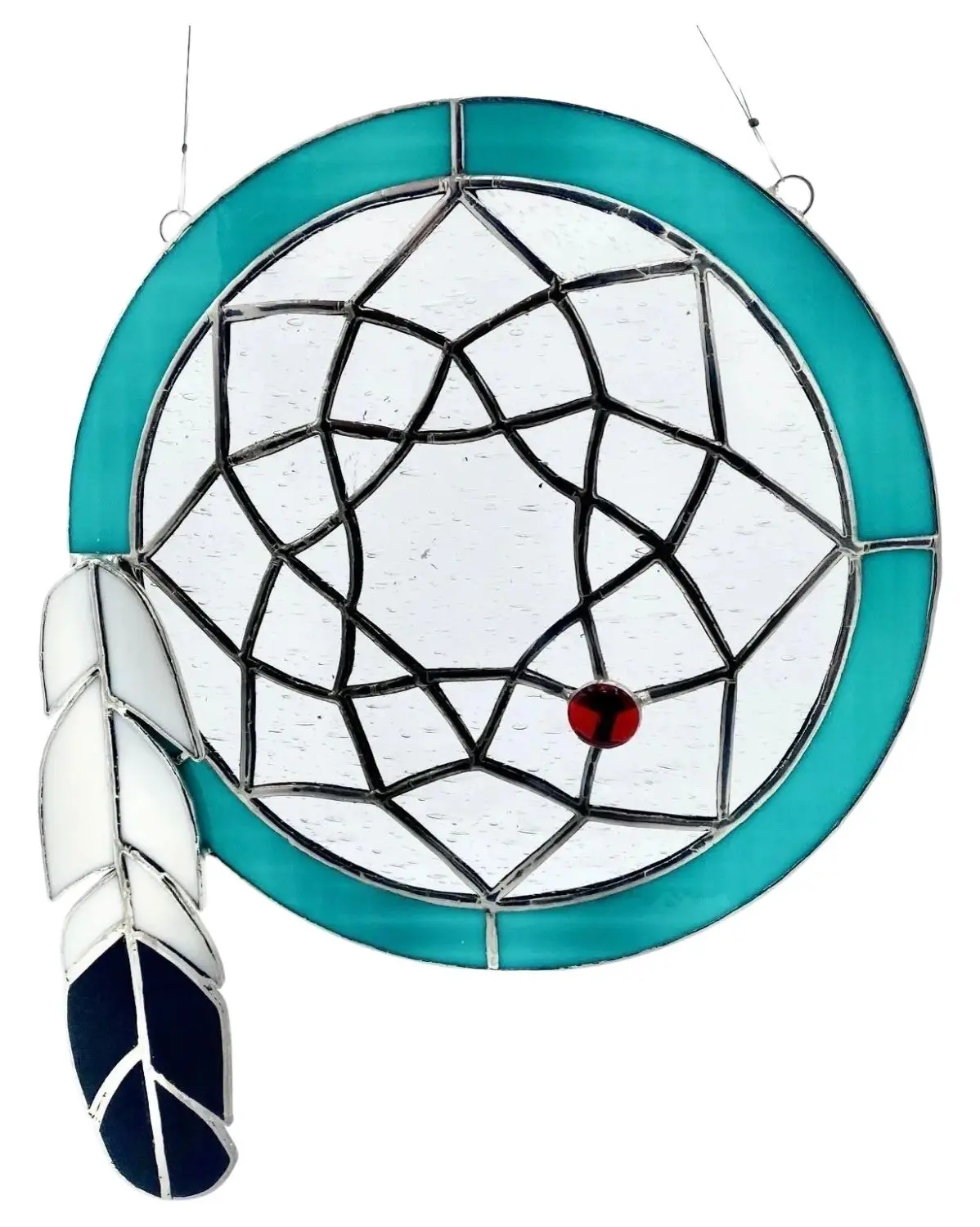 A stained glass window with a feather and a blue circle.