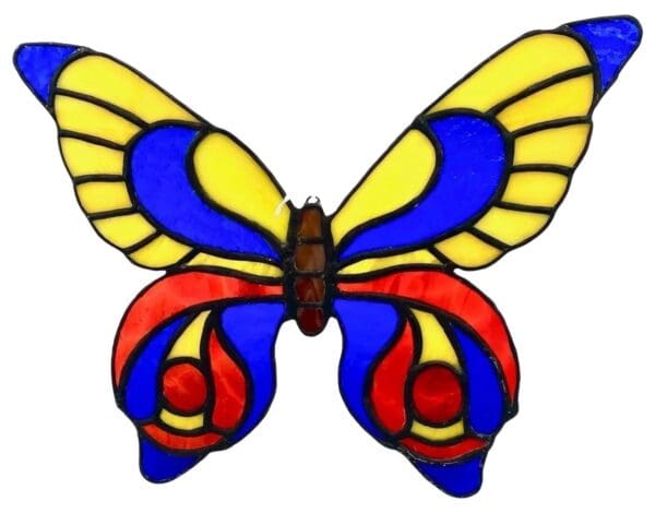 A stained glass butterfly with blue, yellow and red wings.