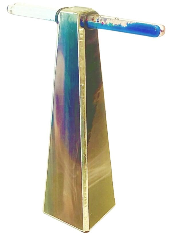 A tall colorful wooden cross with a blue and purple background.