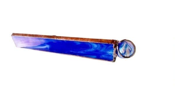 A blue and brown stick with a clock on it