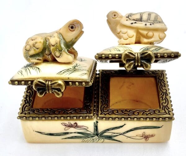 A close up of two boxes with animals on them