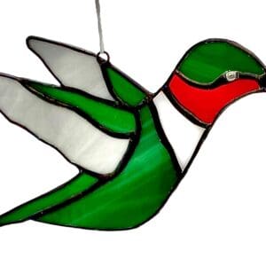 A stained glass hummingbird hanging from the ceiling.