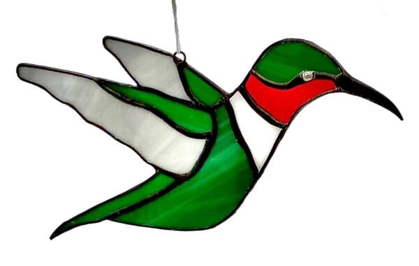 A stained glass hummingbird hanging from the ceiling.