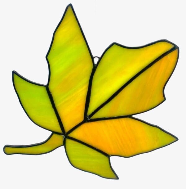 A stained glass leaf is shown in yellow.