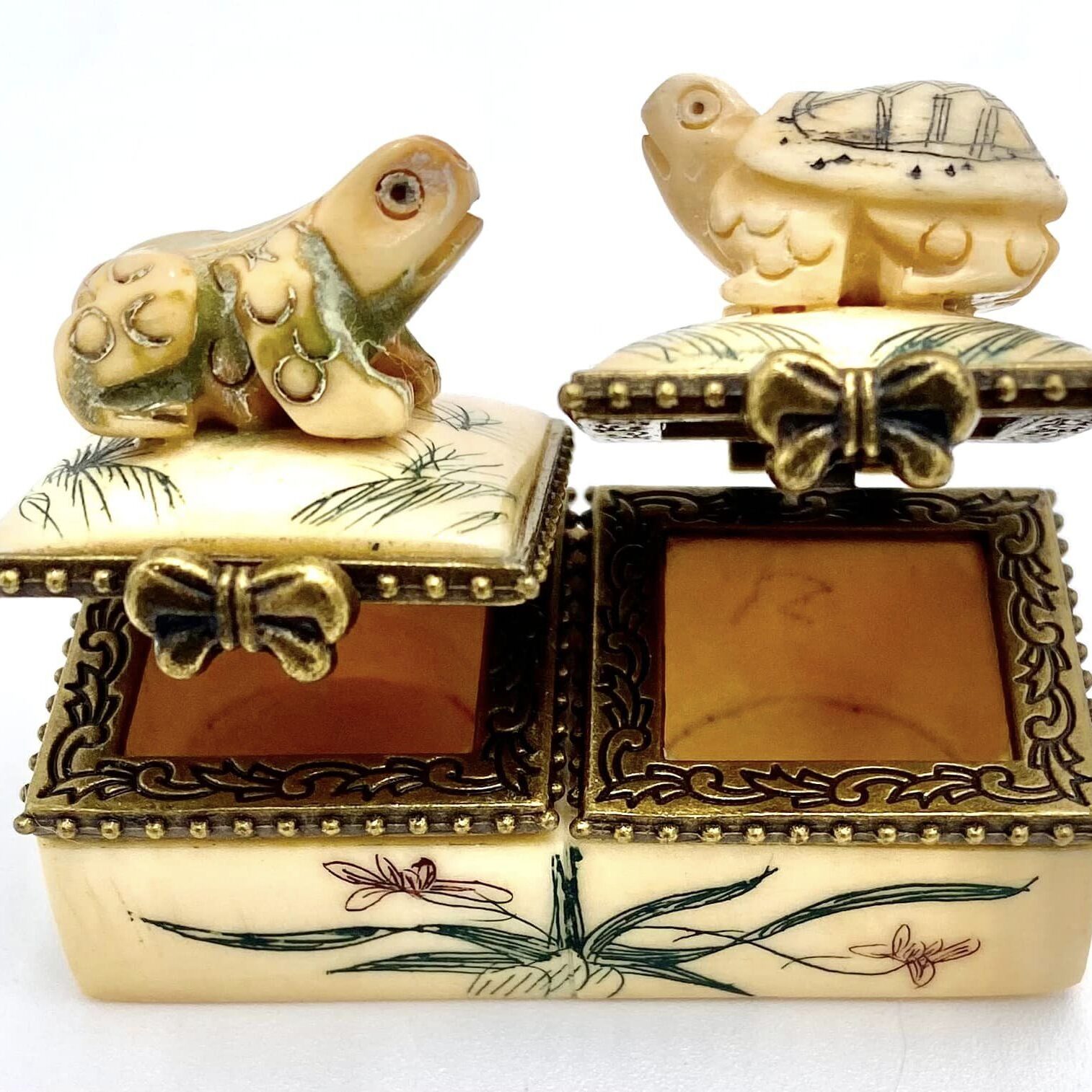 A close up of two boxes with animals on them