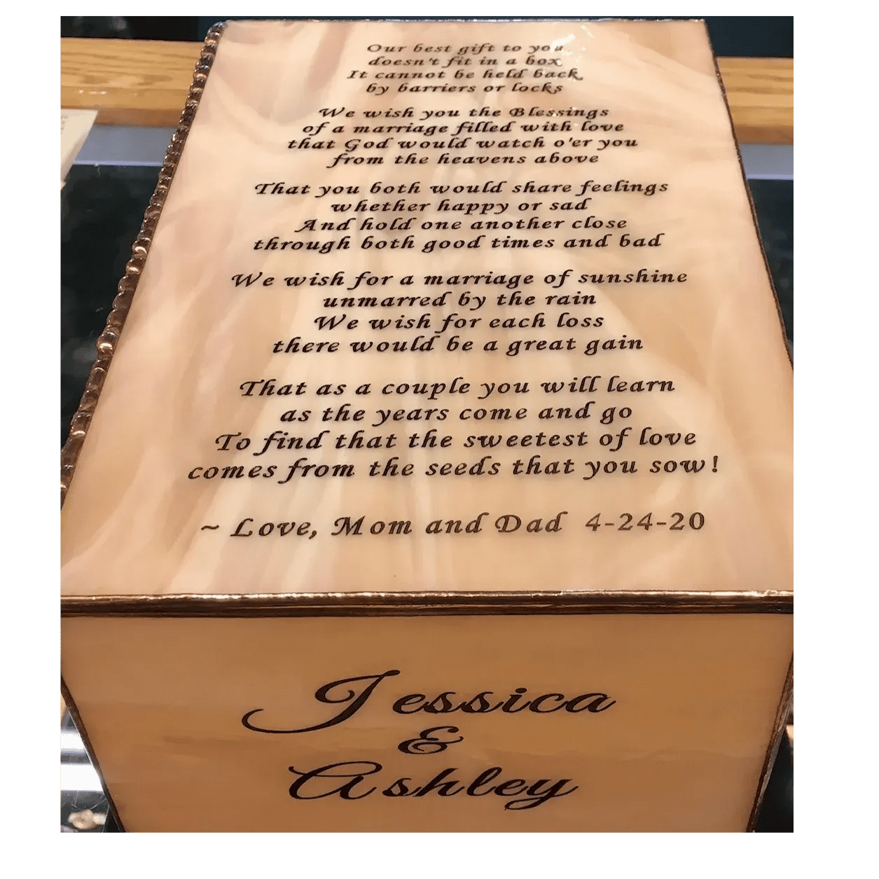 A wooden box with the words " jessica & ashley ".